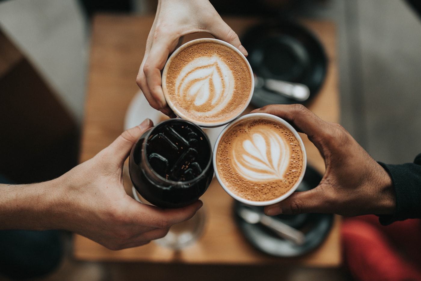 premium espresso pour with chocolate beans, warm beige interior, editorial food photography, no woman